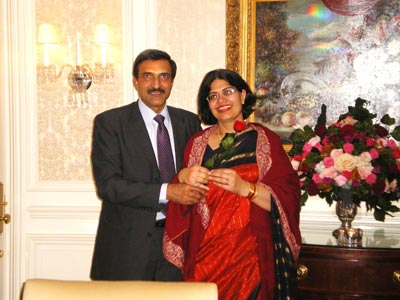 Mr.& Mrs. Prakash on her birthday with red rose